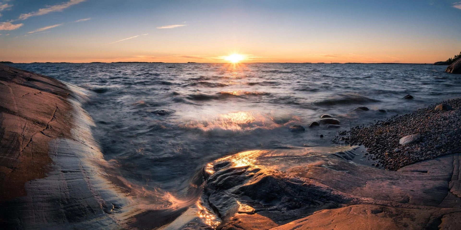 Scenic landscape with sunset and sea at summer evening in Hanko, Finland