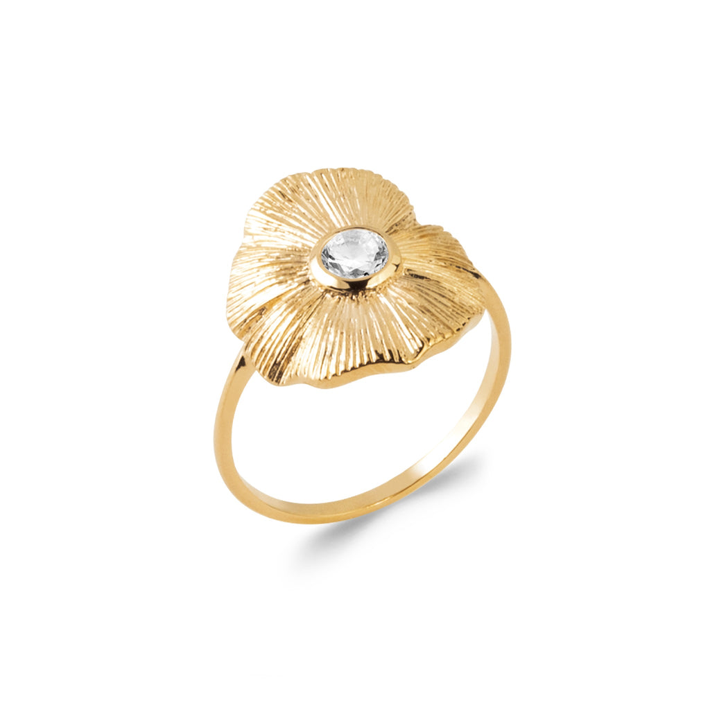 18K gold-plated floral ring with sculpted petals and a luminous center stone in a sculptural statement design by HNKO