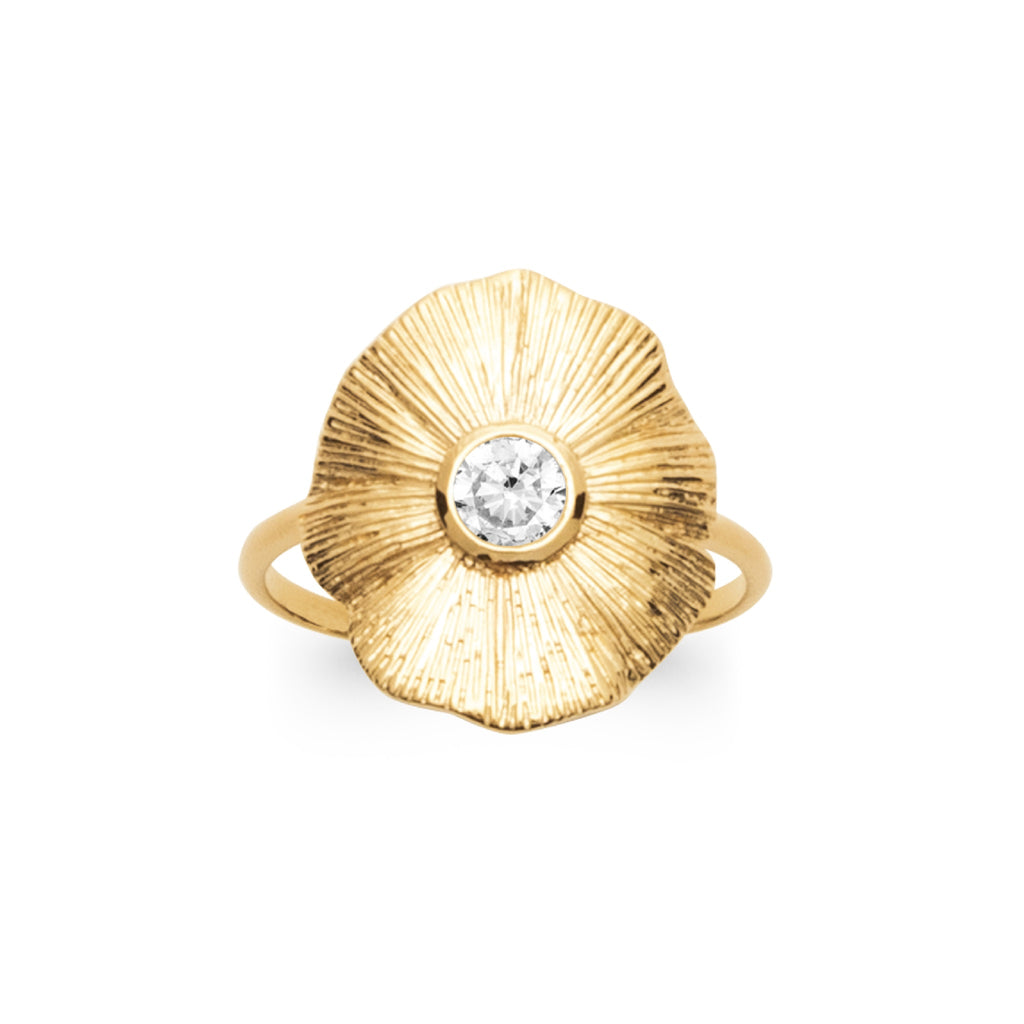 18K gold-plated floral ring with sculpted petals and a luminous center stone in a sculptural statement design by HNKO